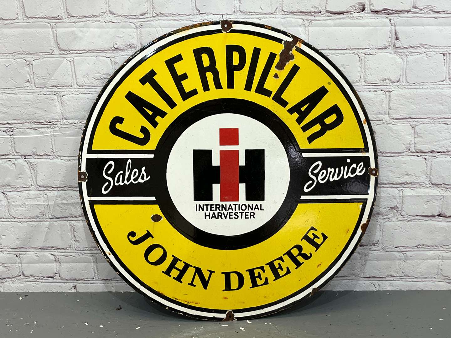 <p>Caterpillar & John Deere Sales and Service Circular Enamel Sign</p>