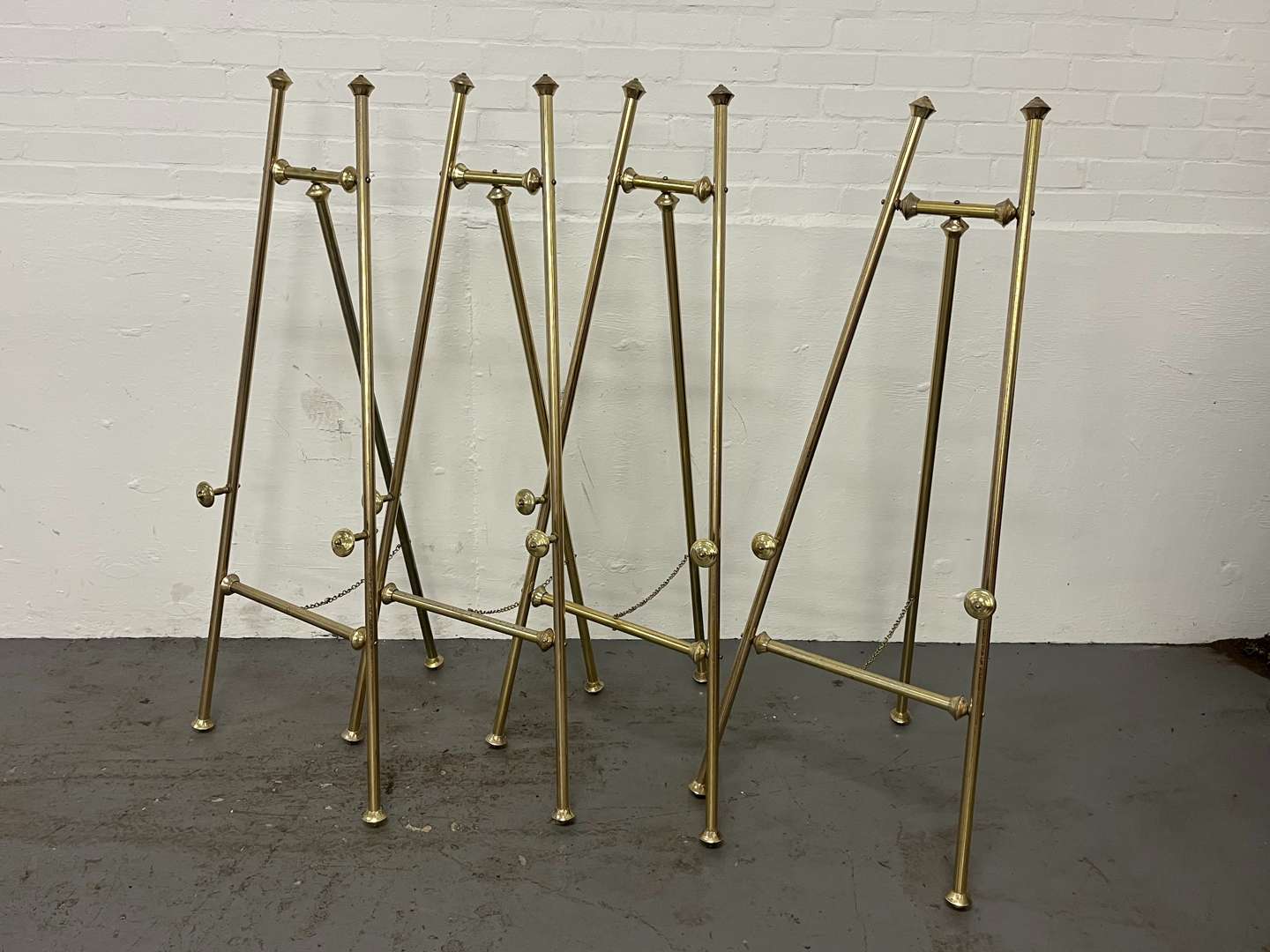 <p>Four Brass Effect Easels&nbsp;</p>