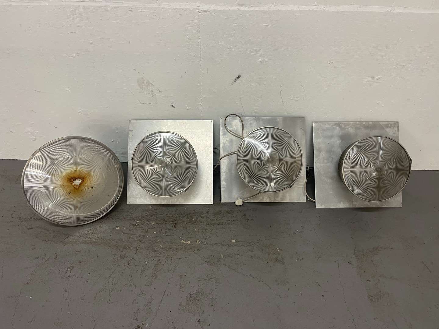 <p>Four Large Industrial Lights&nbsp;</p>