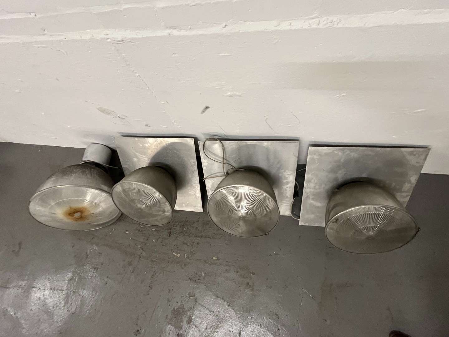 <p>Four Large Industrial Lights&nbsp;</p>