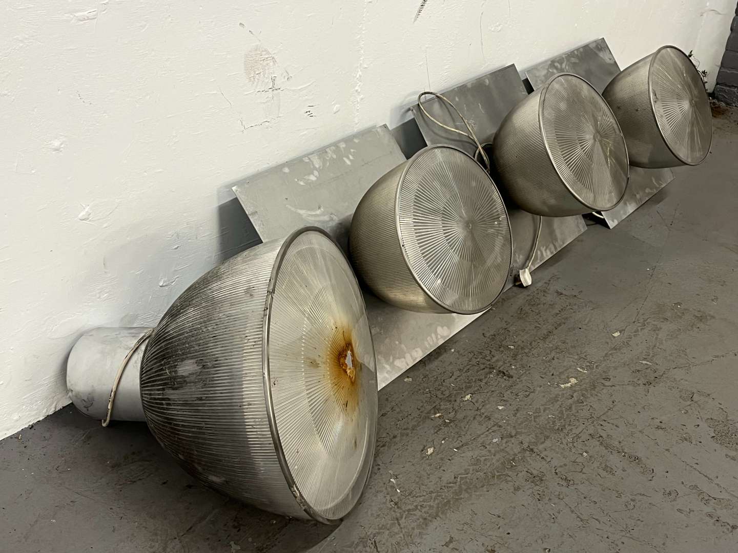 <p>Four Large Industrial Lights&nbsp;</p>