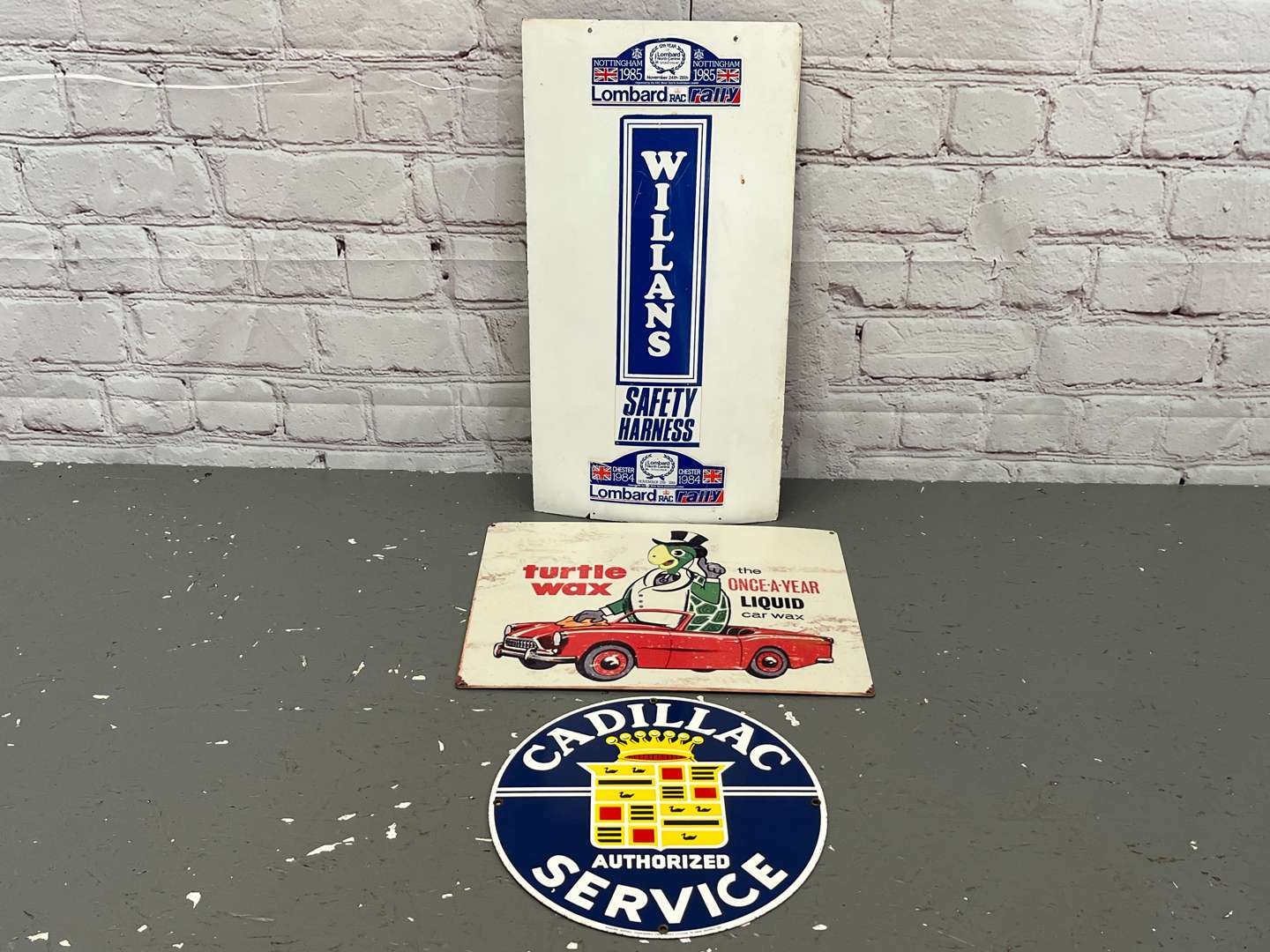 <p>Three Signs, Cadillac Service, Williams Harness Safety & Turtle Wax Sign (3)</p>