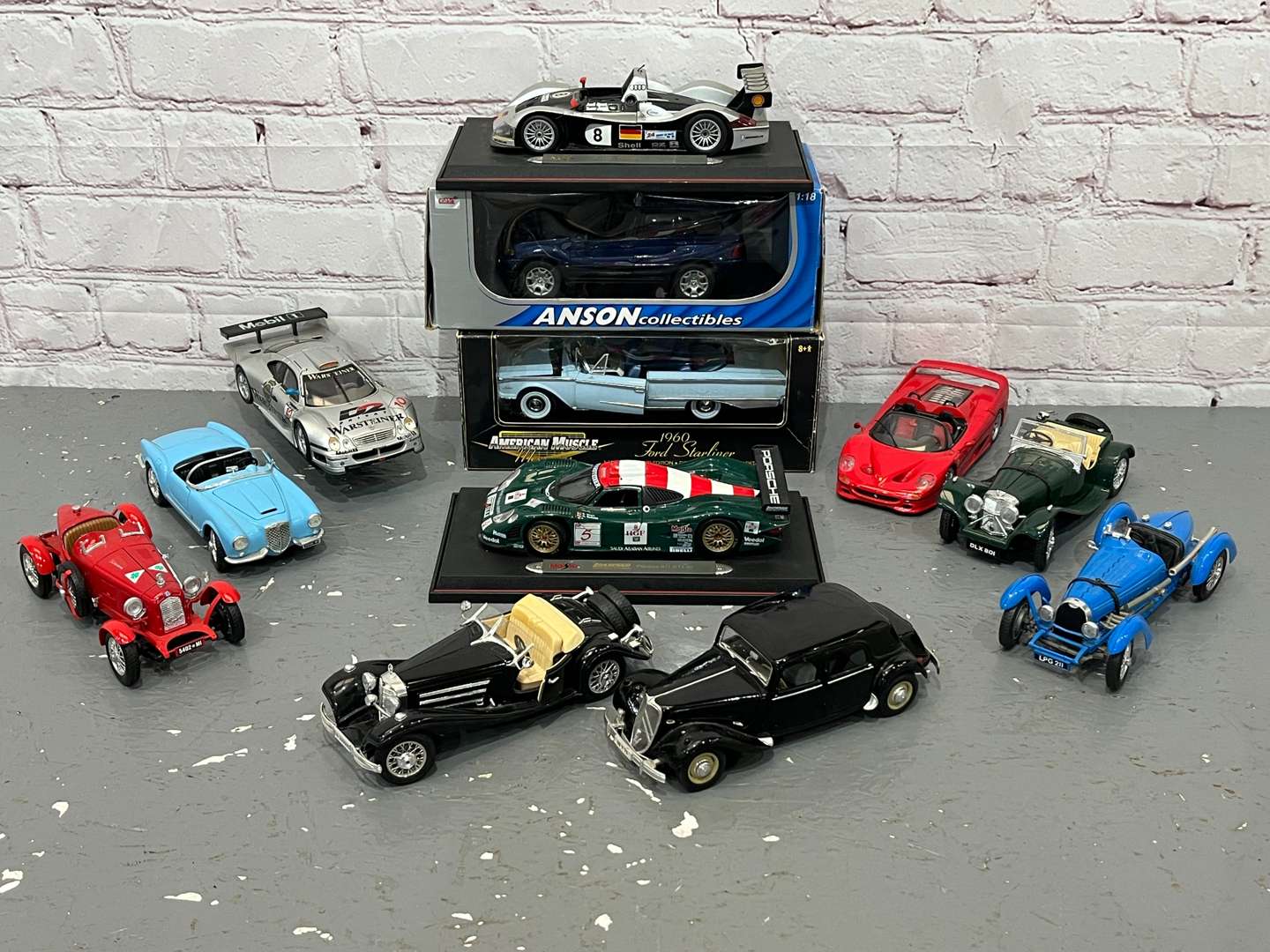 <p>Twelve 1:18 Scale Model Cars</p>