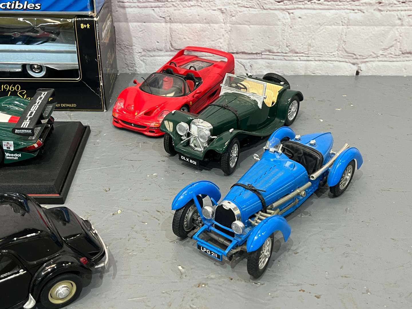 <p>Twelve 1:18 Scale Model Cars</p>