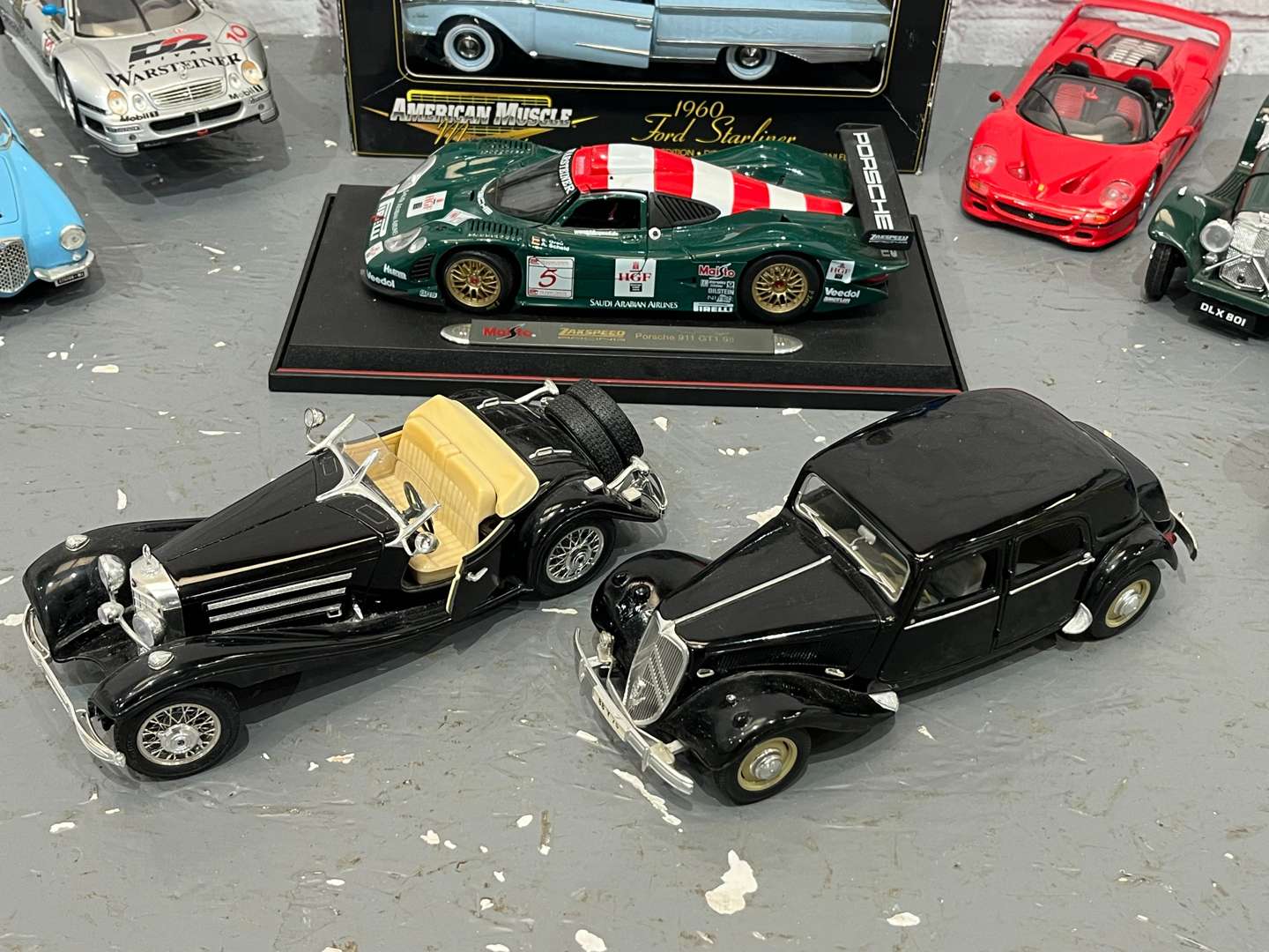 <p>Twelve 1:18 Scale Model Cars</p>