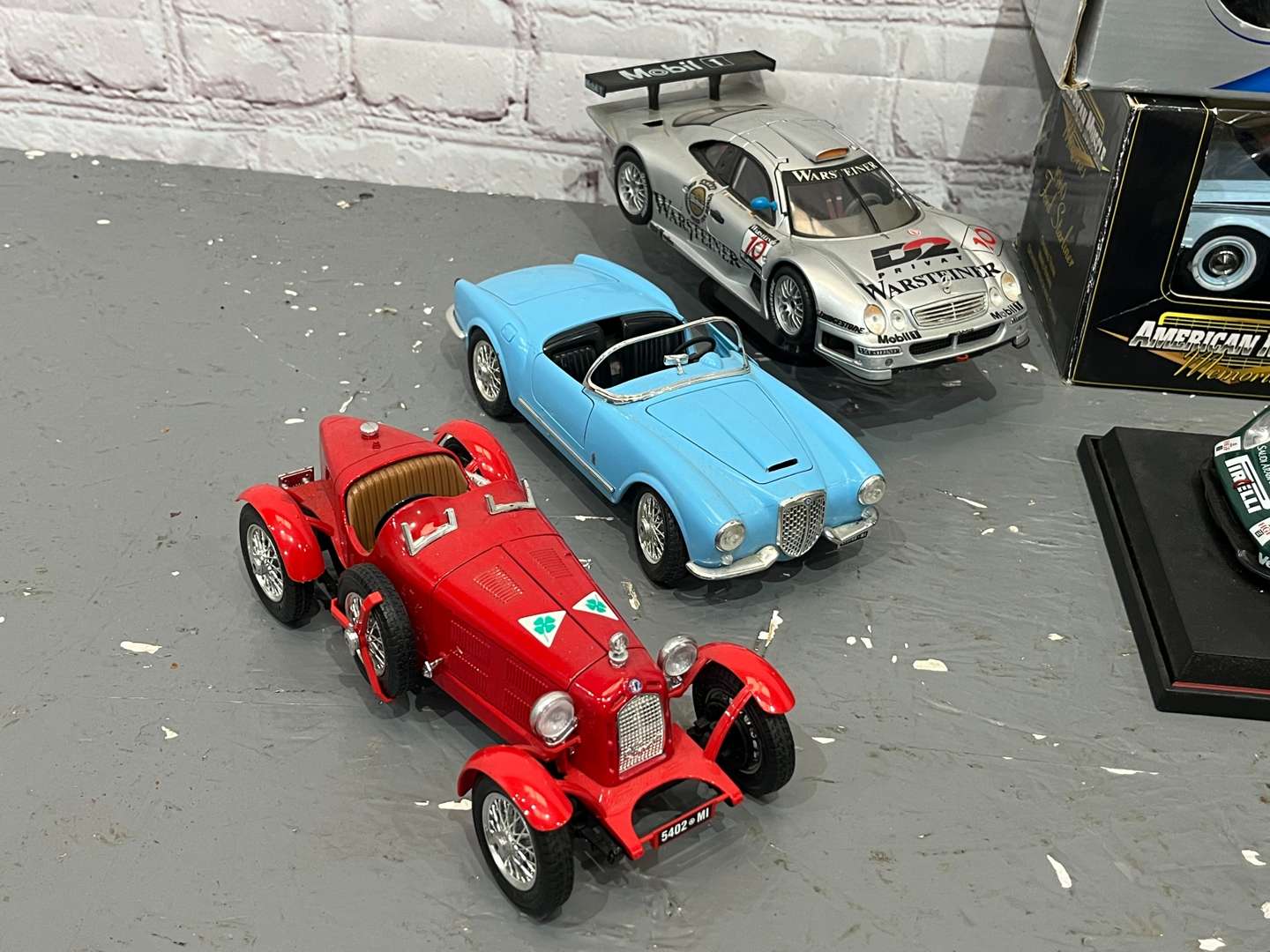 <p>Twelve 1:18 Scale Model Cars</p>