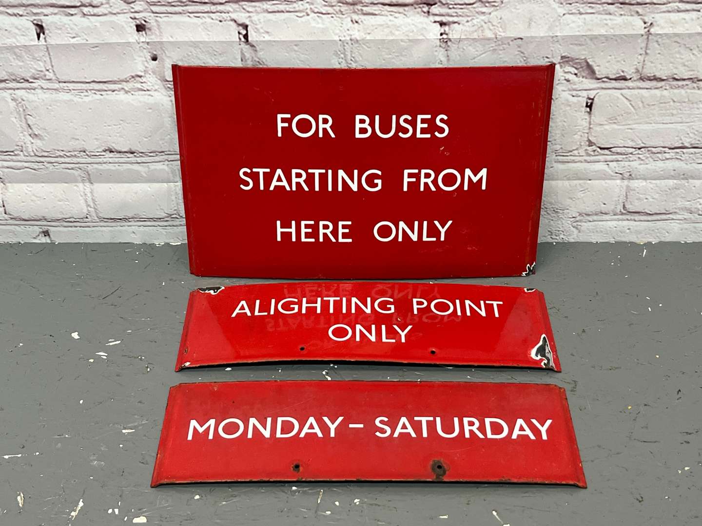 <p>Three Bus Enamel Signs</p>
