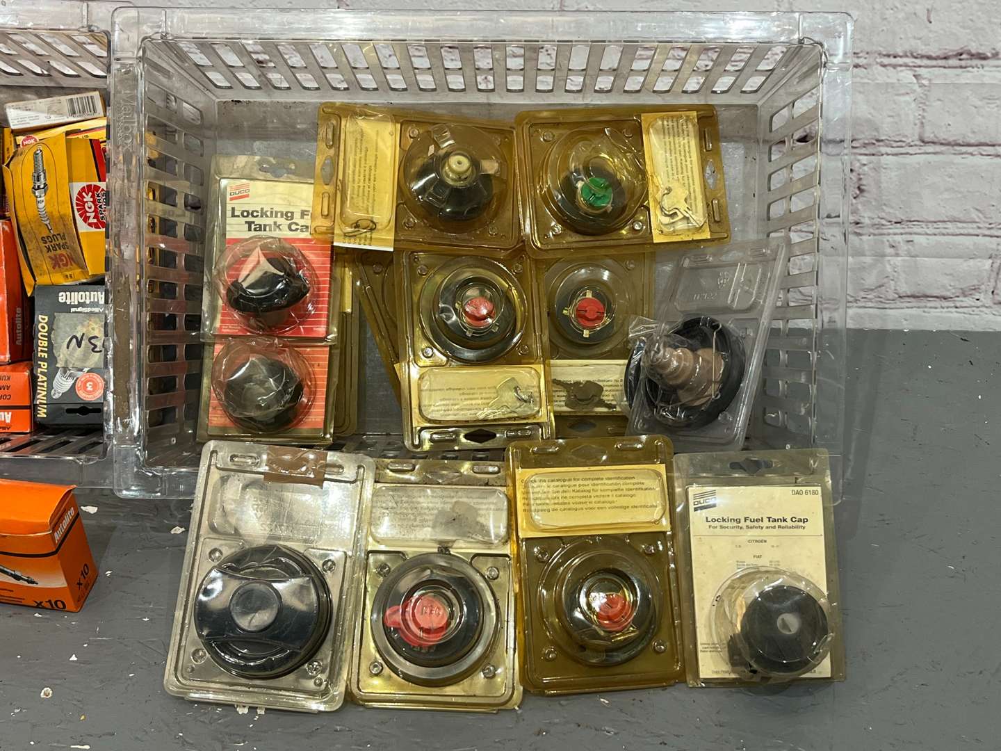 <p>Two Boxes Spark Plugs, Petrol Caps Etc</p>