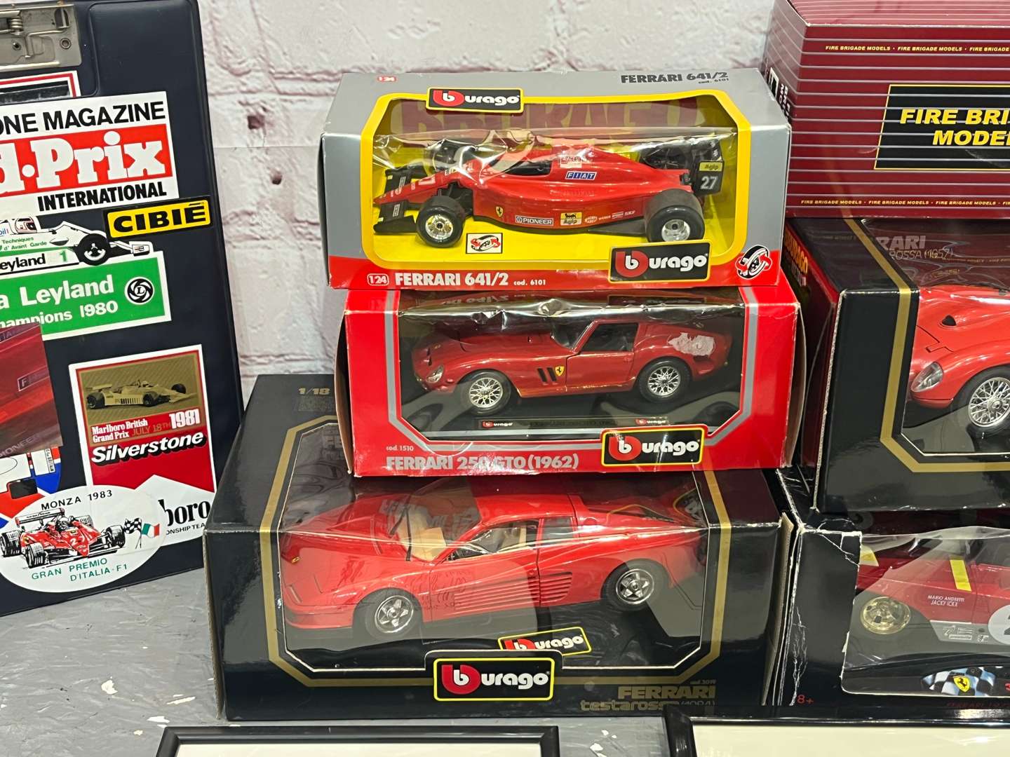 <p>Burago Boxed Ferrari Models, AA Badges Etc</p>