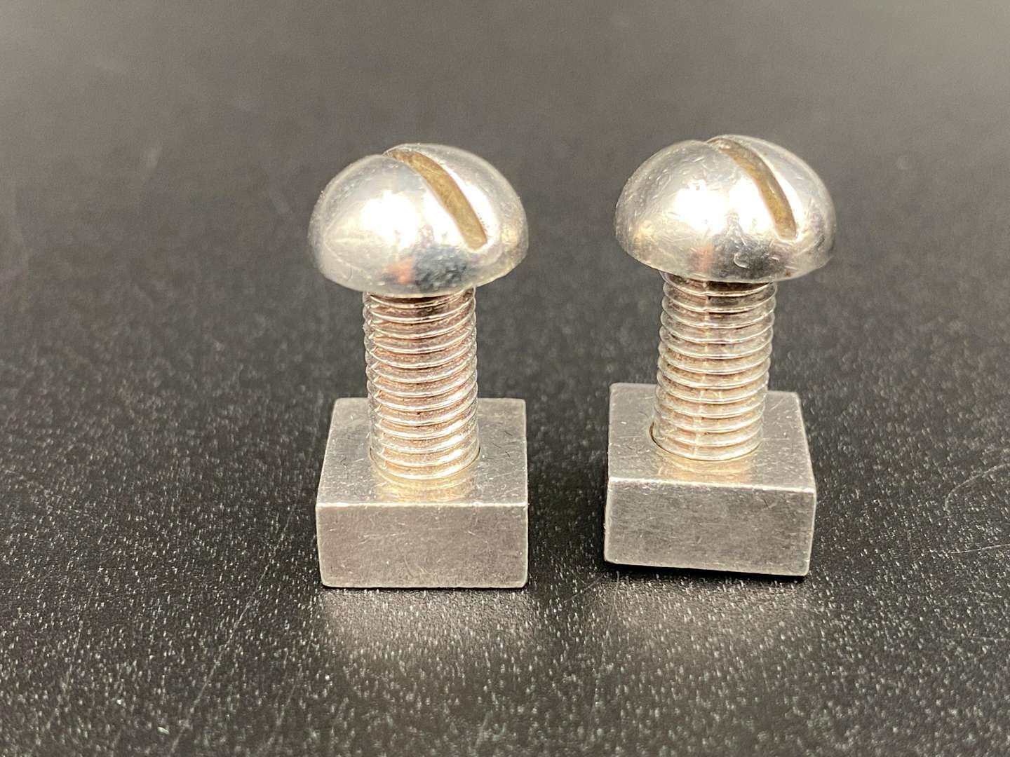 <p>NJI, A MODERN PAIR OF NUT & BOLT CUFFLINKS</p>