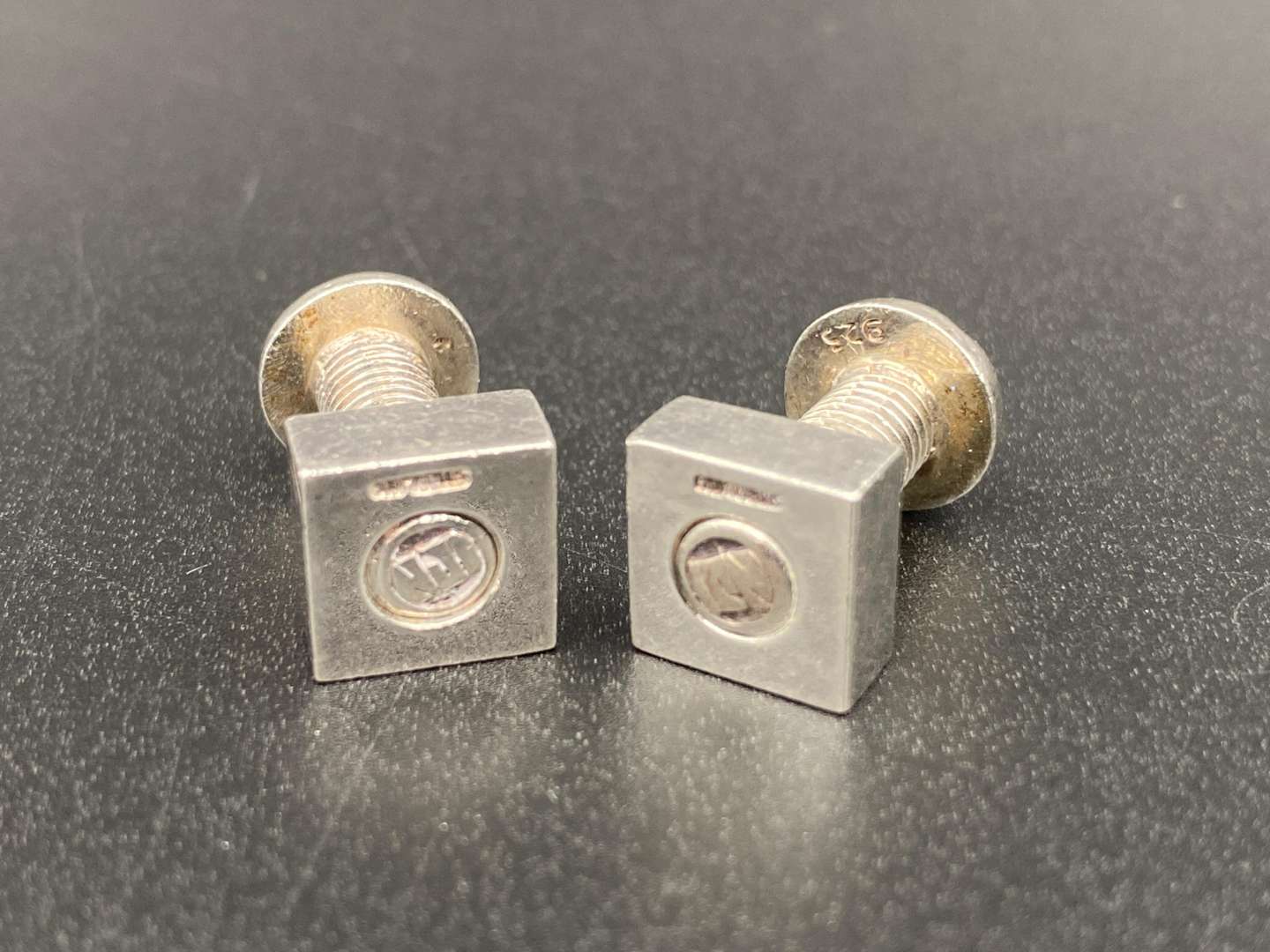 <p>NJI, A MODERN PAIR OF NUT & BOLT CUFFLINKS</p>