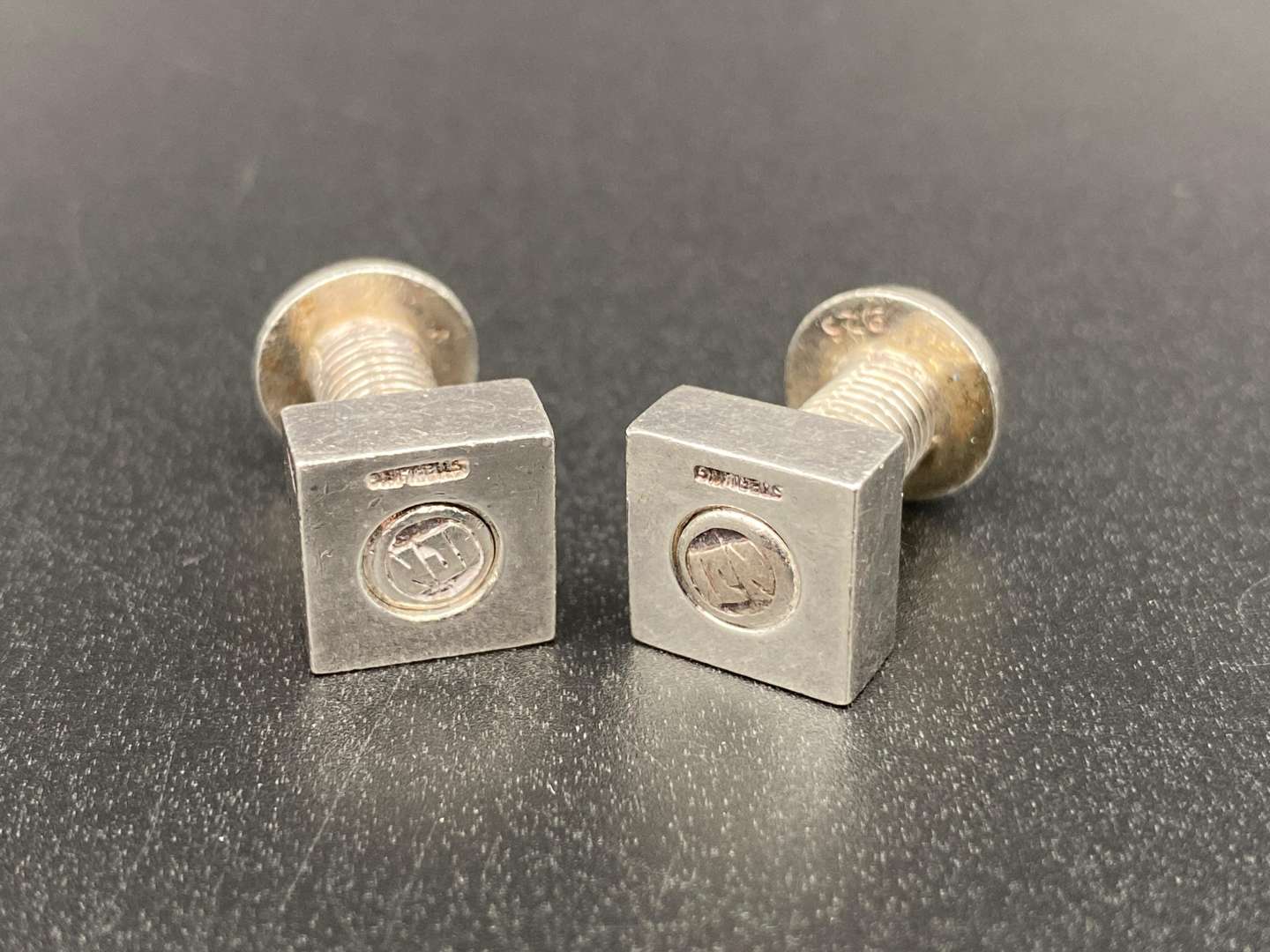 <p>NJI, A MODERN PAIR OF NUT & BOLT CUFFLINKS</p>