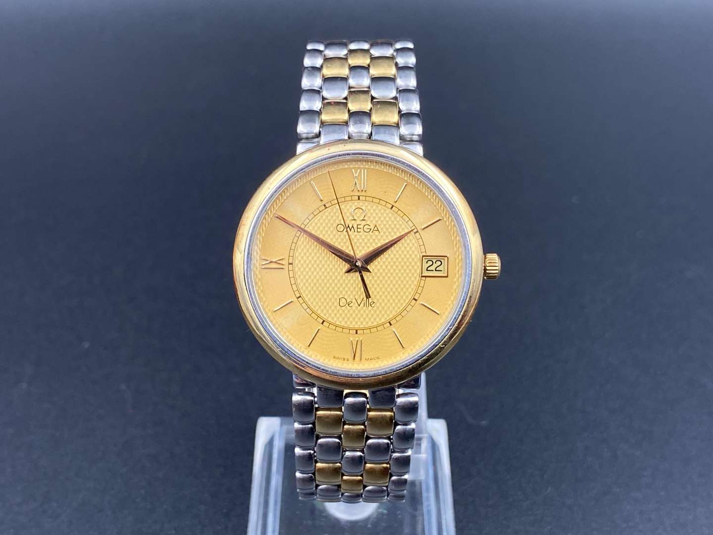 <p>OMEGA, DEVILLE, BI-METAL, QUARTZ, CENTRE SECONDS, CALENDAR, WRISTWATCH</p>
