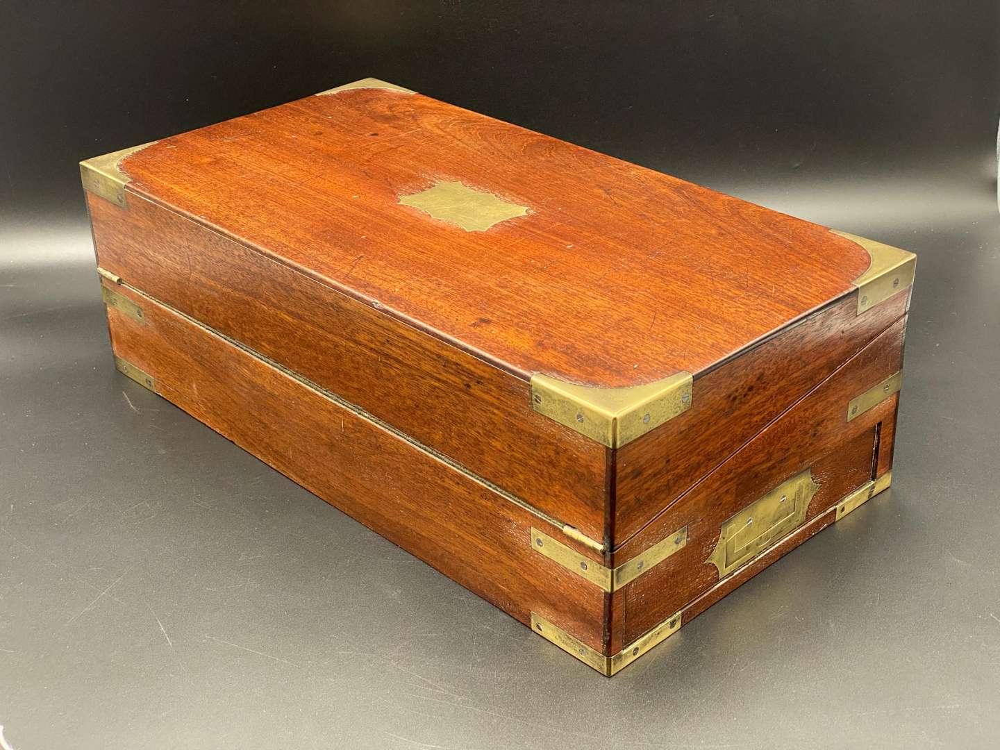 <p>MAHOGANY, BRASS BOUND WRITING SLOPE</p>