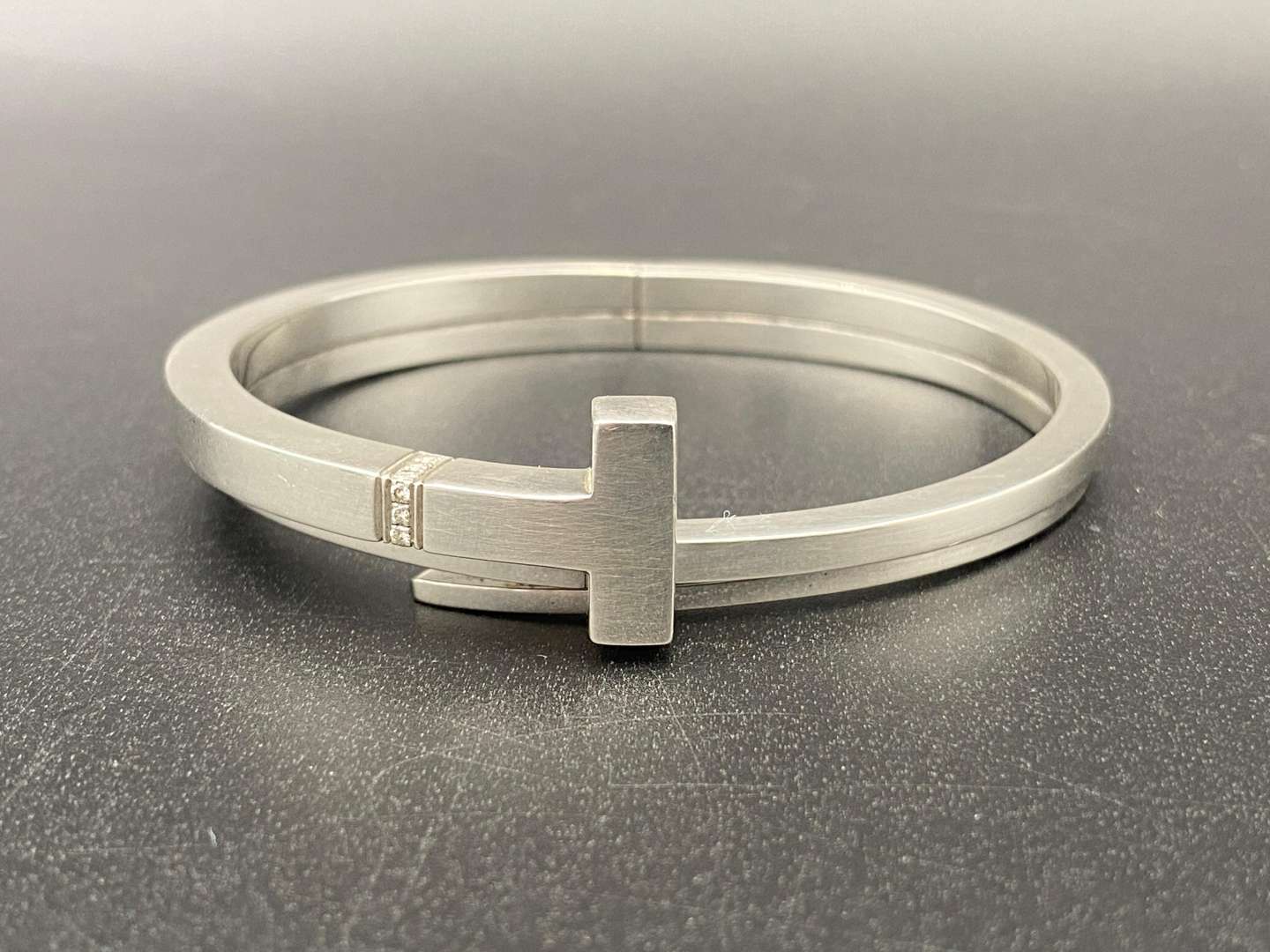<p>TIFFANY & Co, .925 SILVER & DIAMOND T-SQUARE WRAP BRACELET</p>