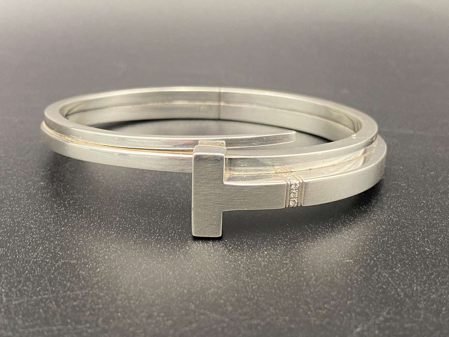 <p>TIFFANY & Co, .925 SILVER & DIAMOND T-SQUARE WRAP BRACELET</p>