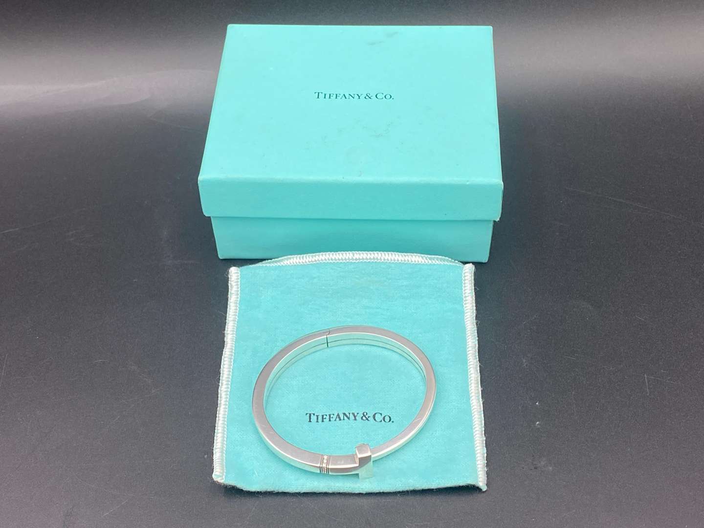 <p>TIFFANY & Co, .925 SILVER & DIAMOND T-SQUARE WRAP BRACELET</p>