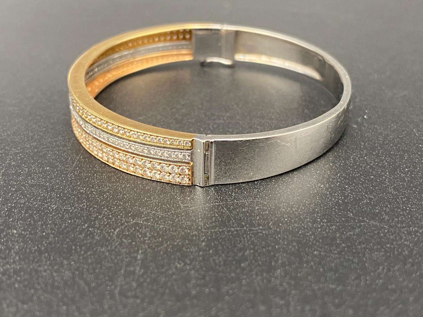 <p>TRI COLOURED GOLD AND DIAMOND BRACELET, &nbsp;3KT</p>