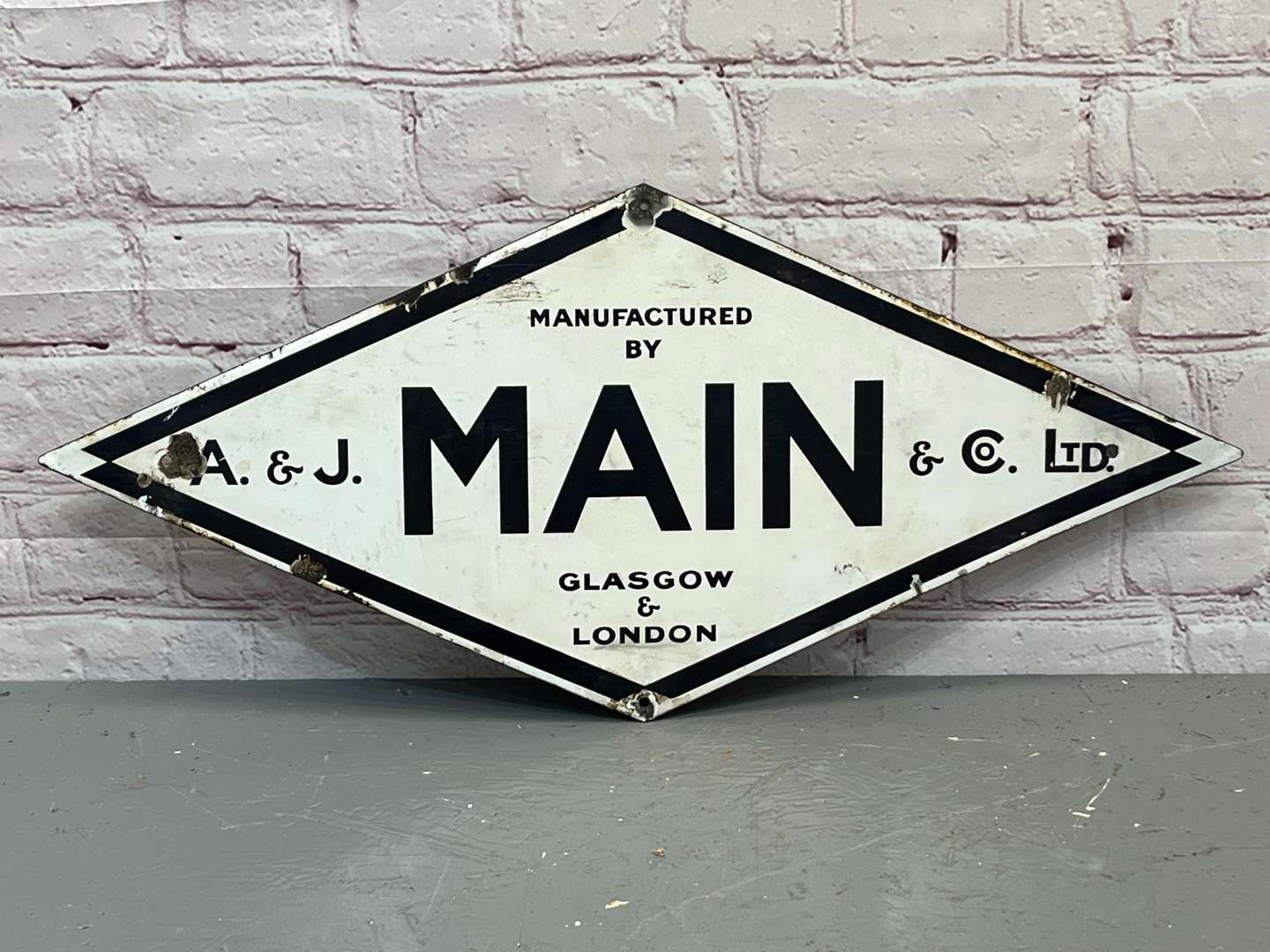 <p>A & J Main & Co Ltd Glasgow & London Diamond Enamel Sign</p>