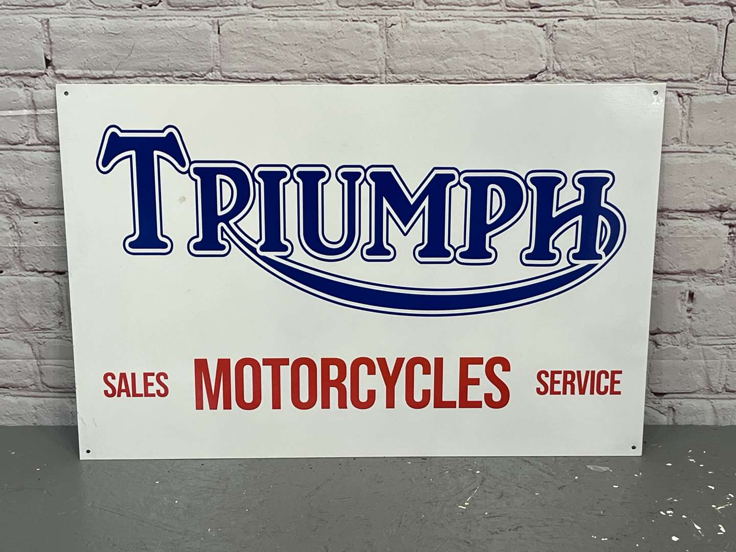 <p>Triumph Motorcycles Sales & Service Metal Sign</p>