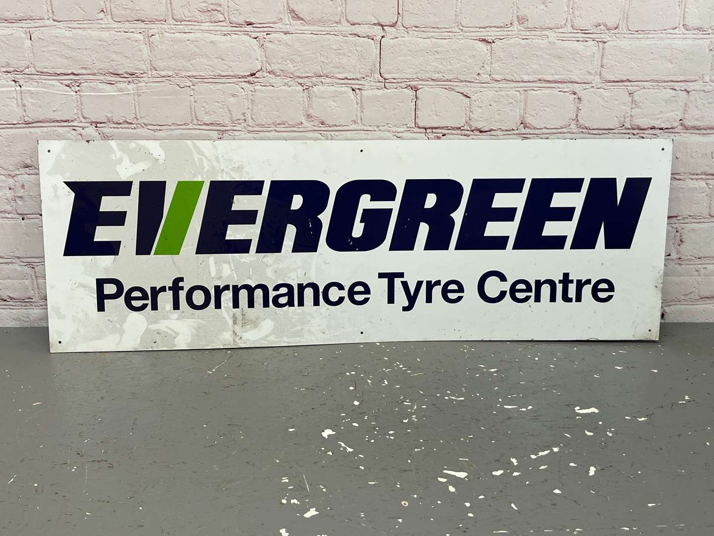 <p>Evergreen Performance Tyres Centre Sign on Metal Board</p>