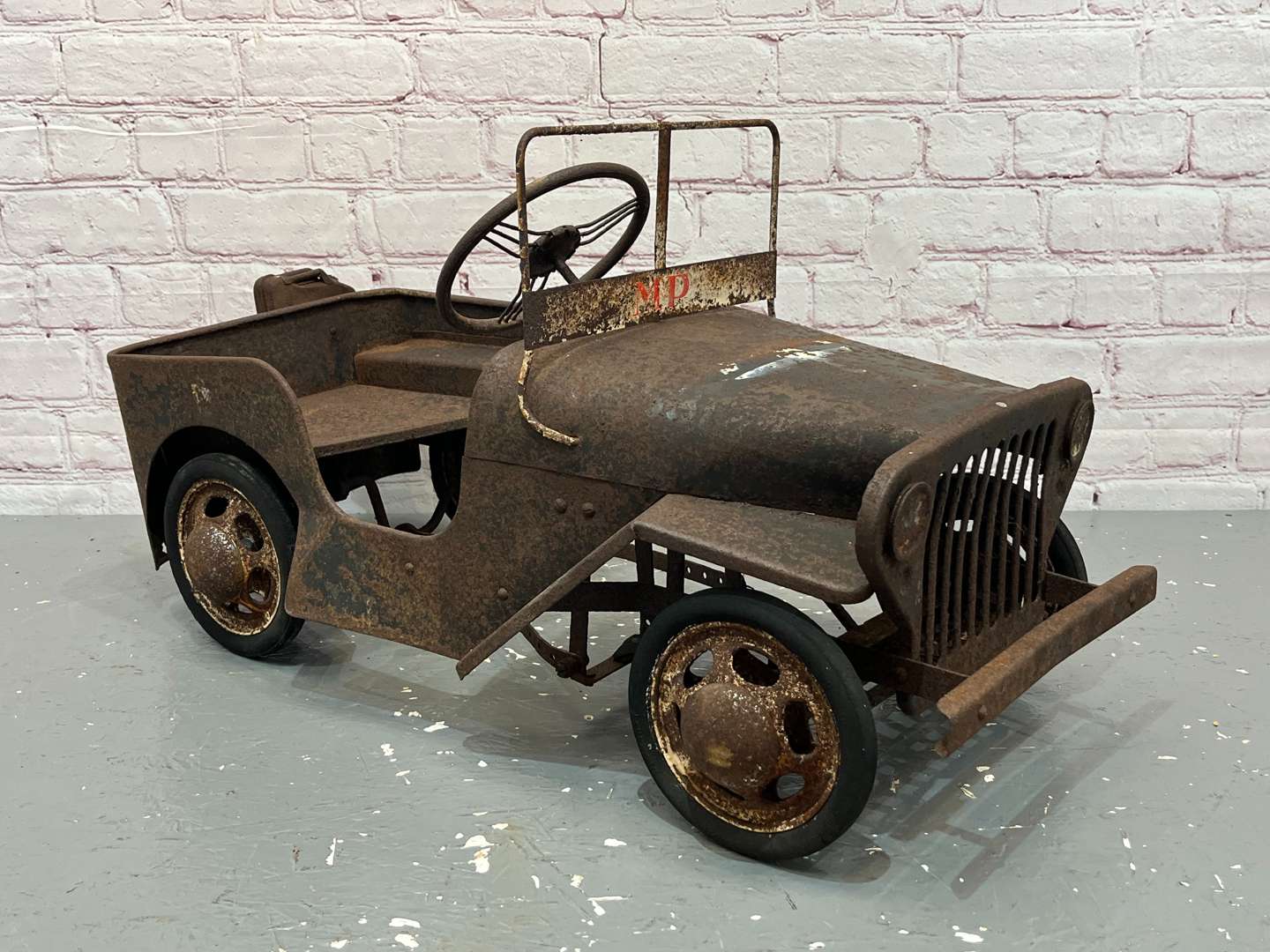 <p>Willy's Jeep Tin Plated Childs Pedal Car</p>