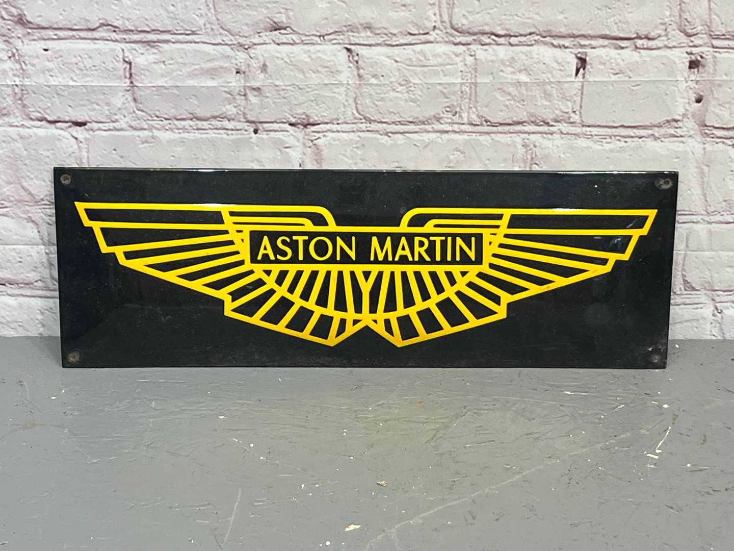 <p>Aston Martin Convex Emblem Enamel Sign</p>
