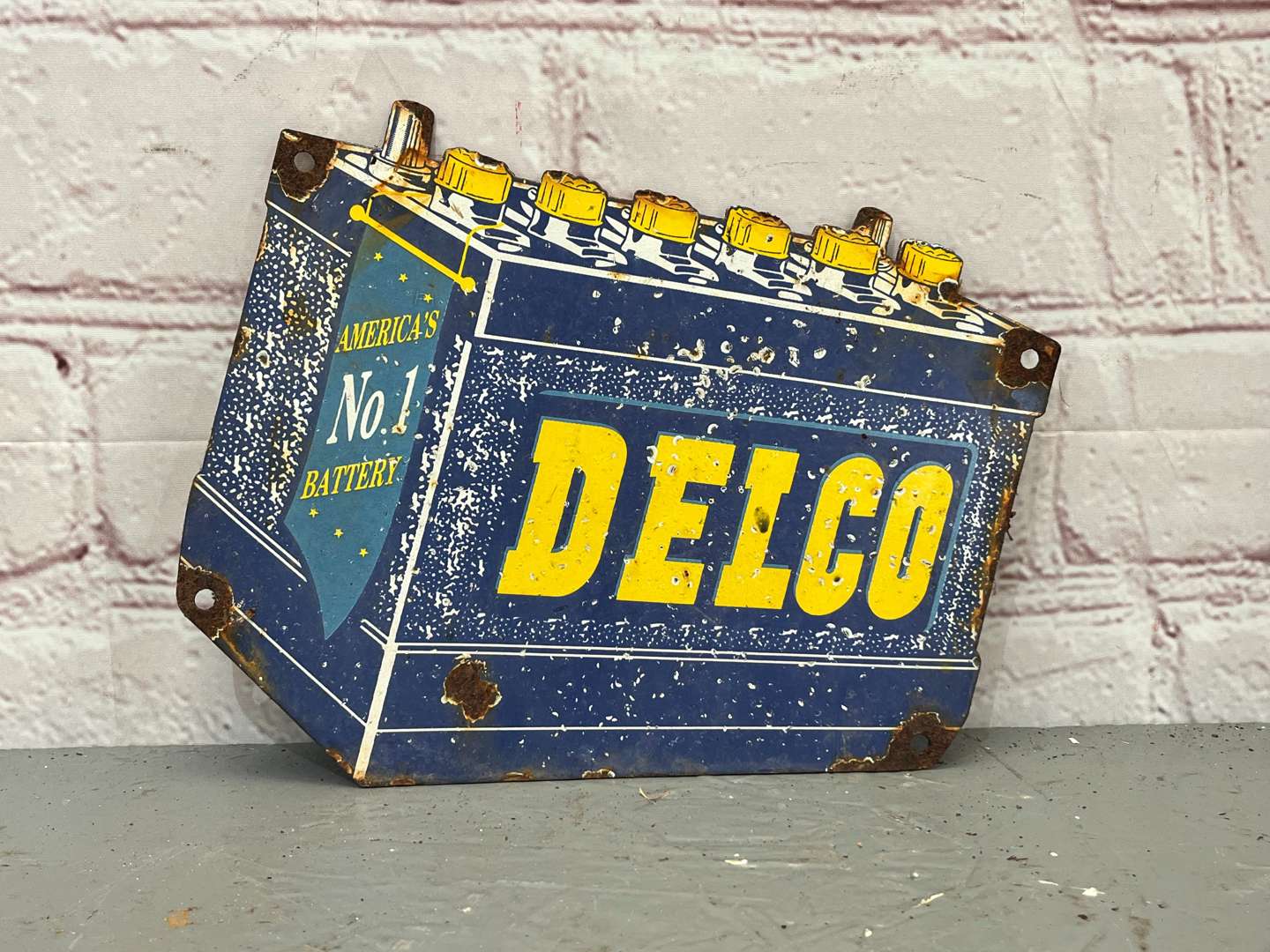 <p>Delco Americas Number 1 Battery Enamel Sign</p>