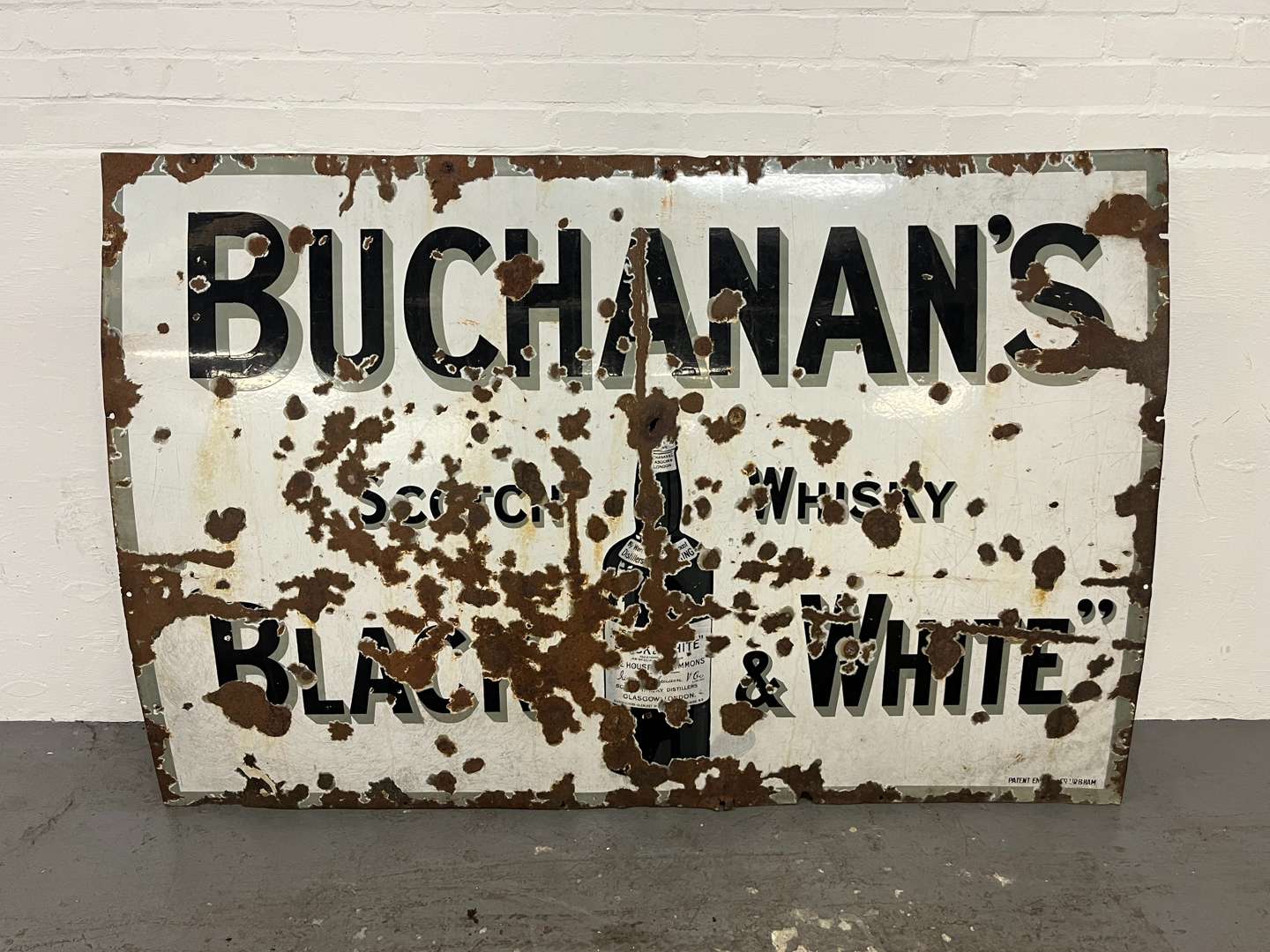 <p>Large Buchanans Scotch Whiskey Black & White Enamel Sign</p>