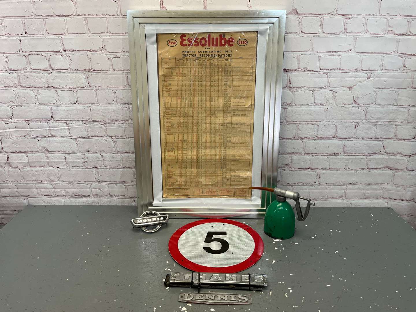 <p>Esso Framed Lubrication Chart, 5 MPH Sign Commercial Badges Etc</p>