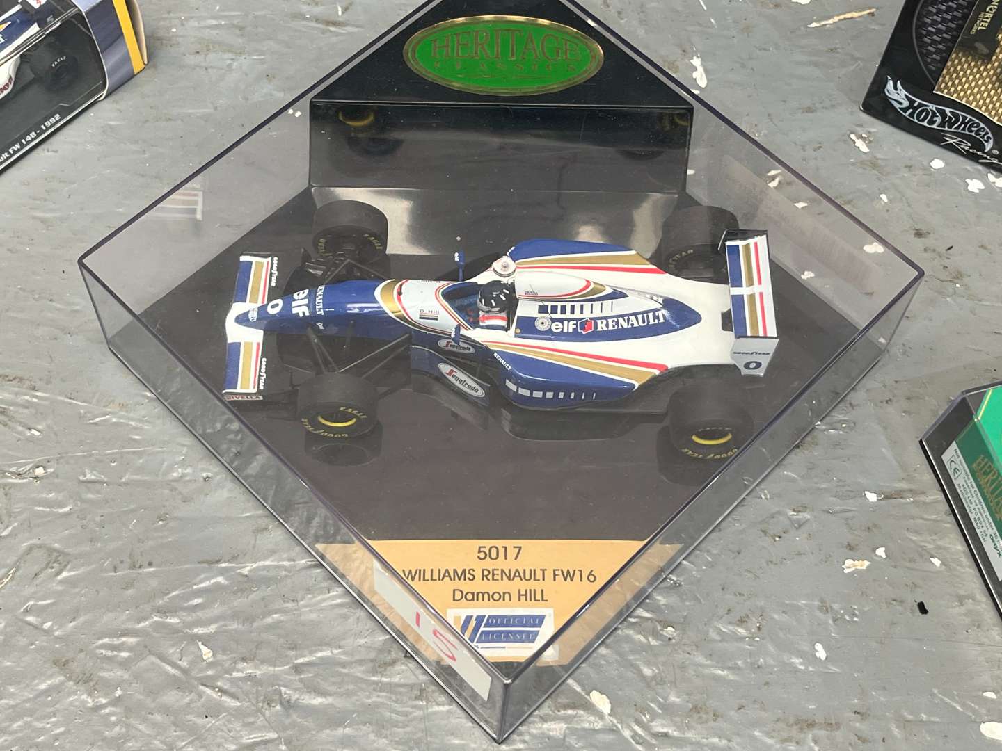 <p>Seven Boxed Formula One Model Cars</p>
