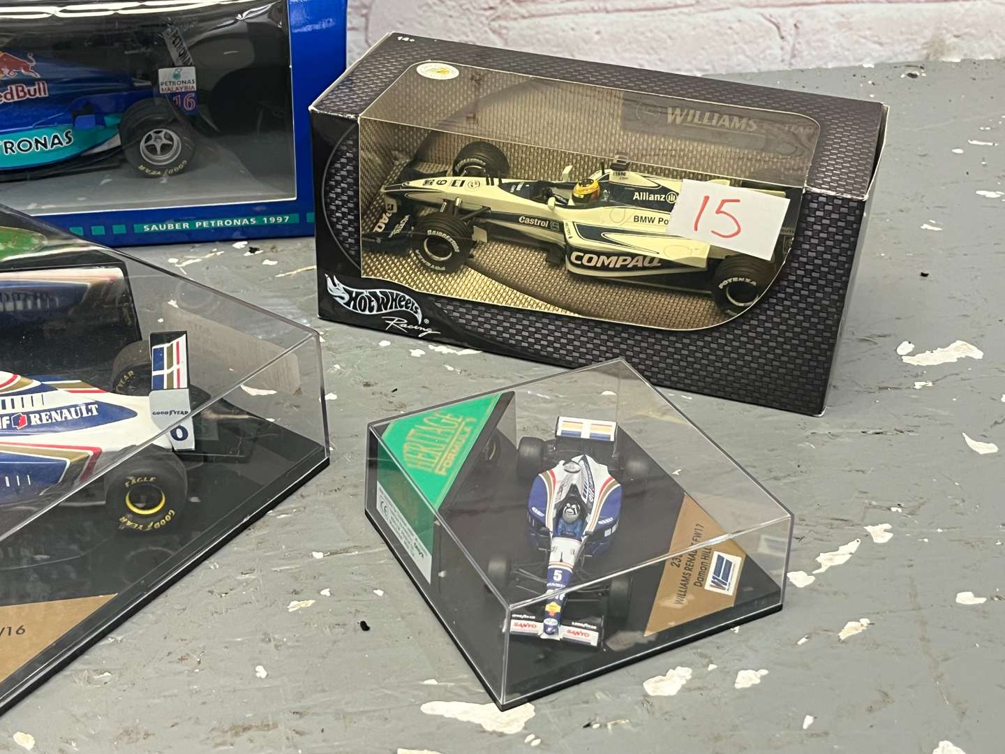 <p>Seven Boxed Formula One Model Cars</p>