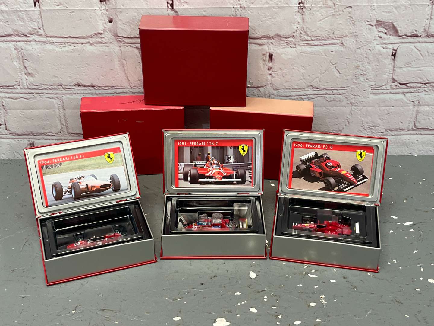 <p>Three Boxed Hotwheels Ferrari F1 Cars 1:24 Scale</p>