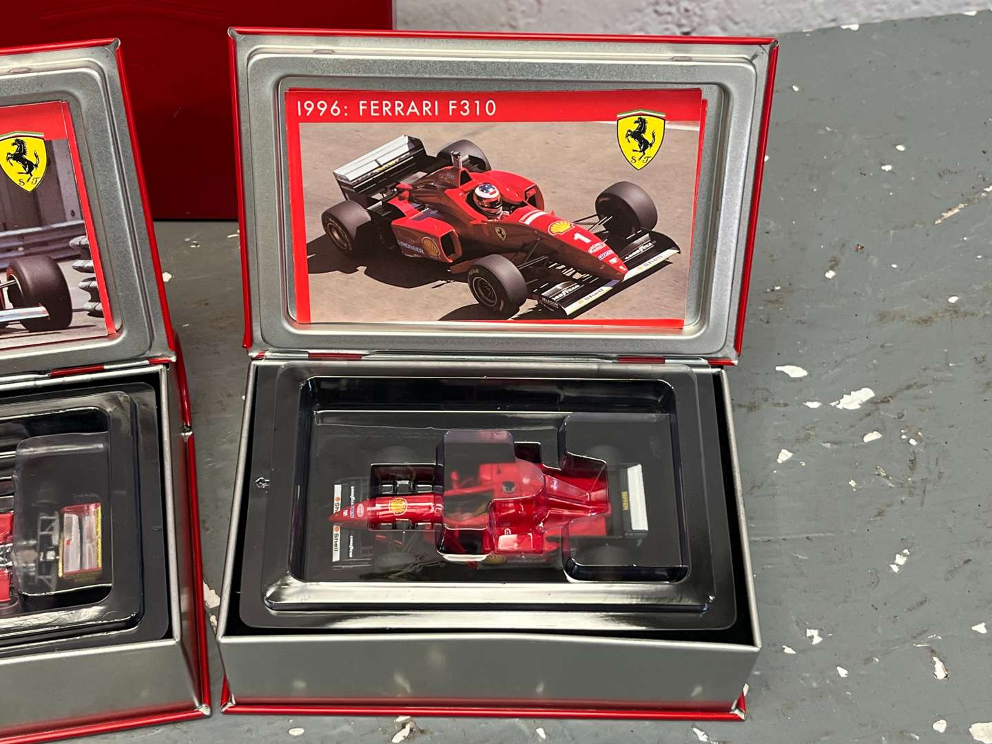 <p>Three Boxed Hotwheels Ferrari F1 Cars 1:24 Scale</p>