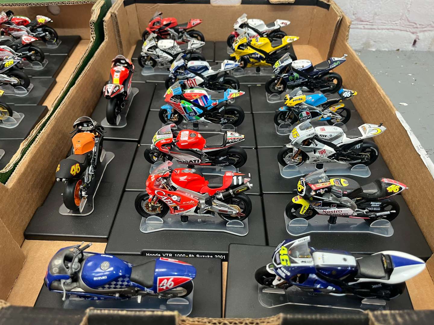 <p>Three Boxes of 46 Valentino Rossi 1:18 Scale Model Motorbikes & Magasines&nbsp;</p>