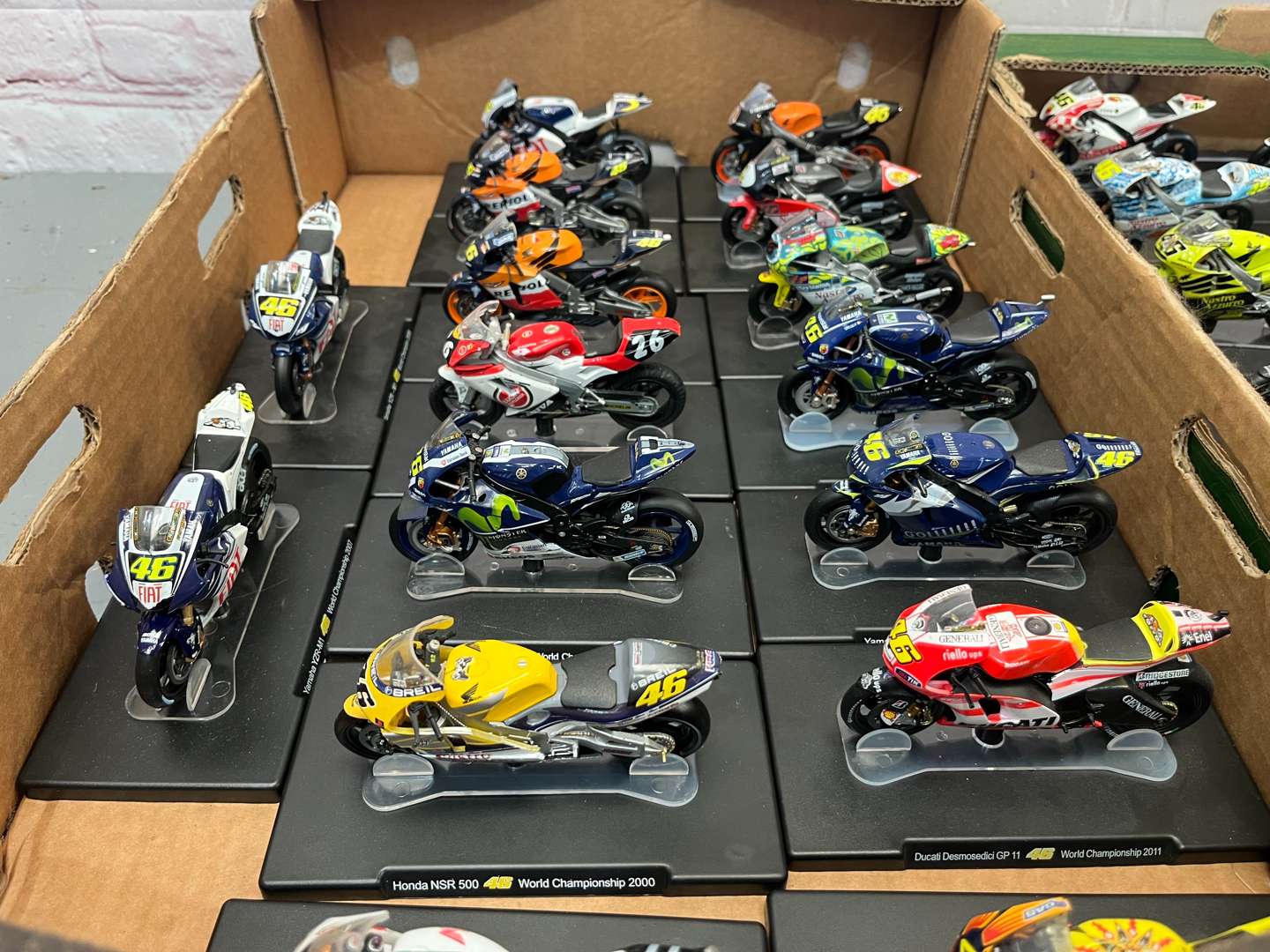 <p>Three Boxes of 46 Valentino Rossi 1:18 Scale Model Motorbikes & Magasines&nbsp;</p>