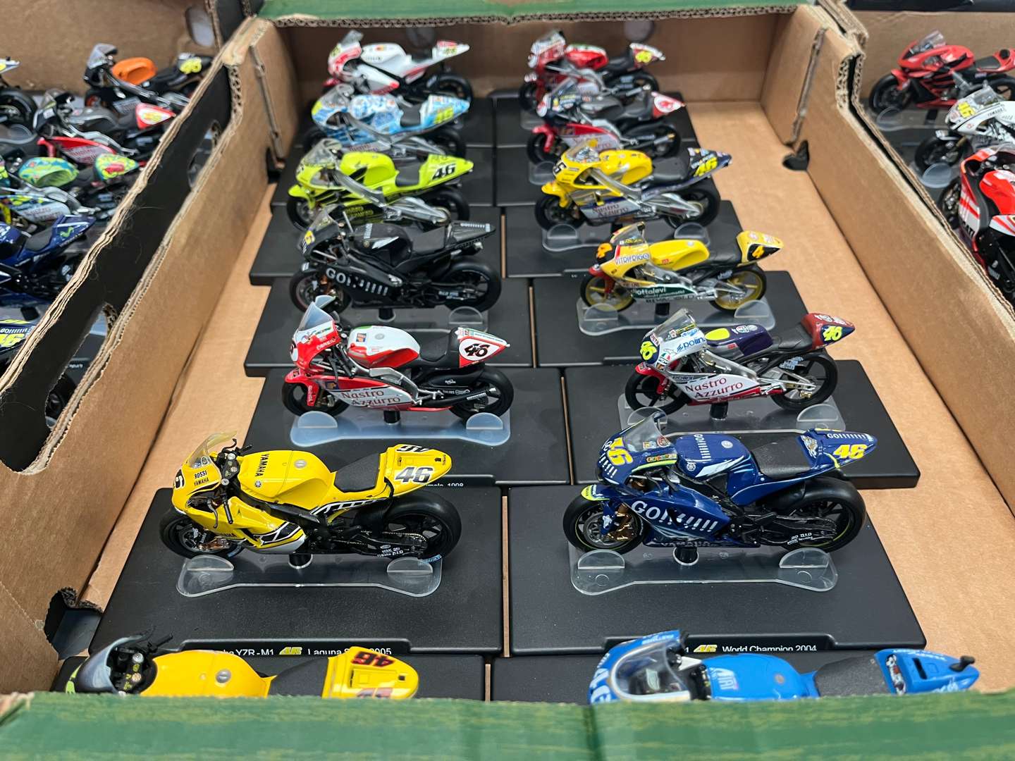 <p>Three Boxes of 46 Valentino Rossi 1:18 Scale Model Motorbikes & Magasines&nbsp;</p>