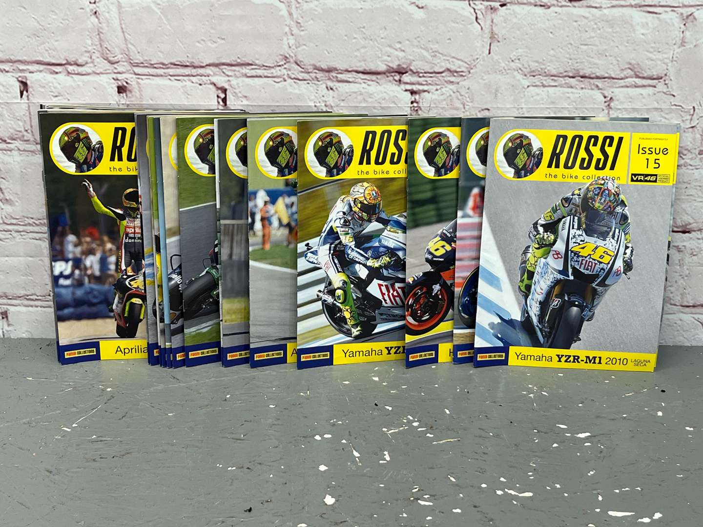 <p>Three Boxes of 46 Valentino Rossi 1:18 Scale Model Motorbikes & Magasines&nbsp;</p>