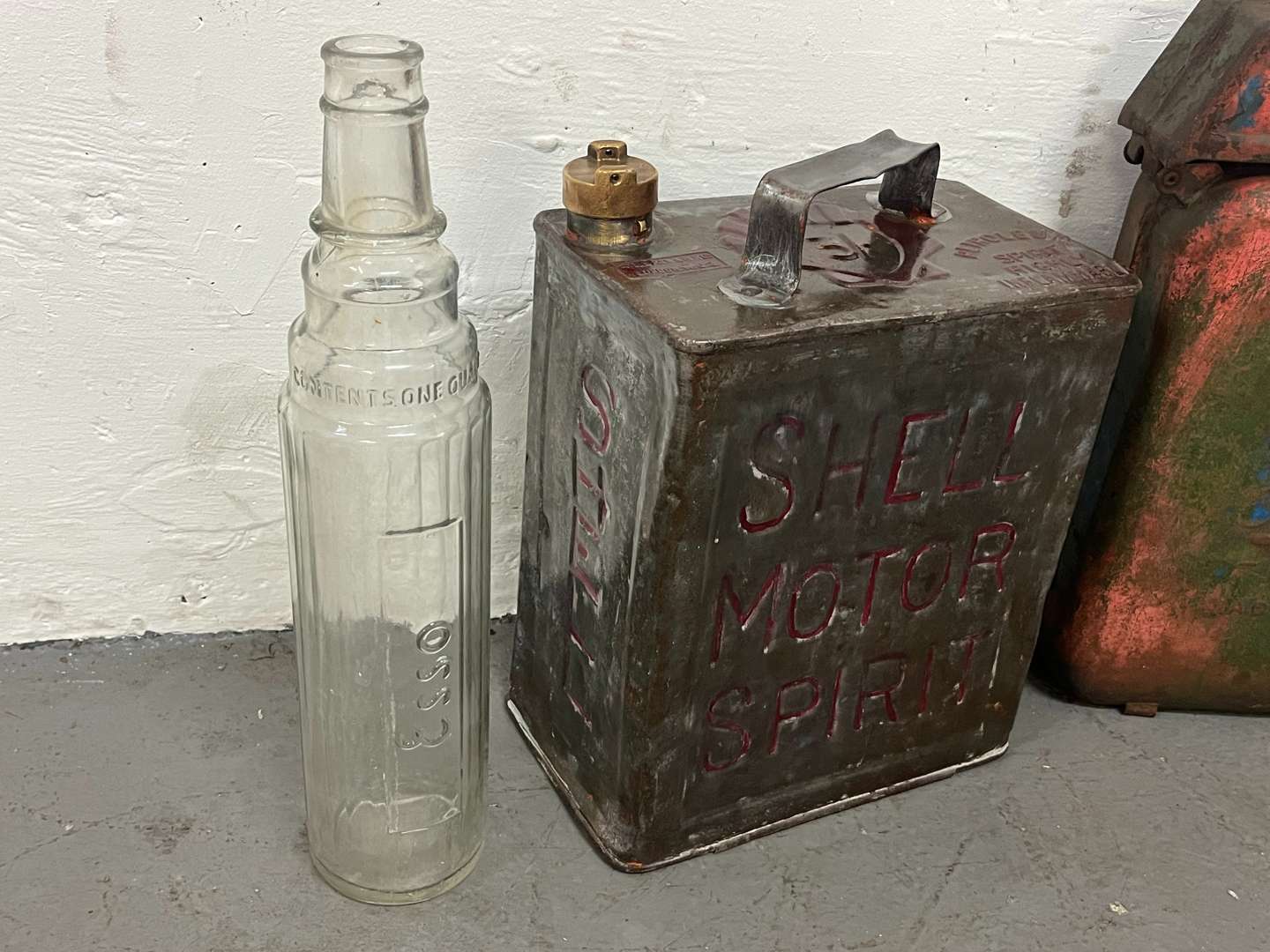 <p>Two Glass Essolube Oil Bottles, Shell Two Gallon Fuel Can & One Other (4)</p>