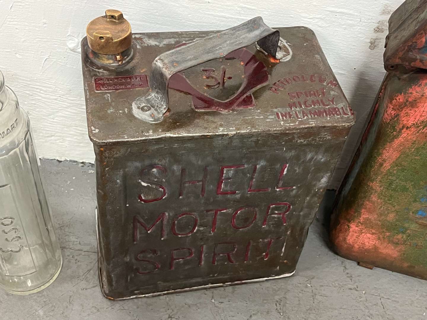 <p>Two Glass Essolube Oil Bottles, Shell Two Gallon Fuel Can & One Other (4)</p>