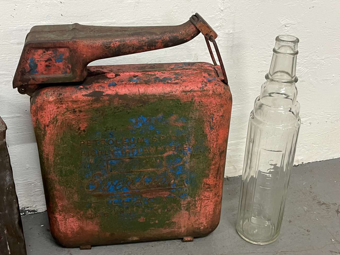 <p>Two Glass Essolube Oil Bottles, Shell Two Gallon Fuel Can & One Other (4)</p>