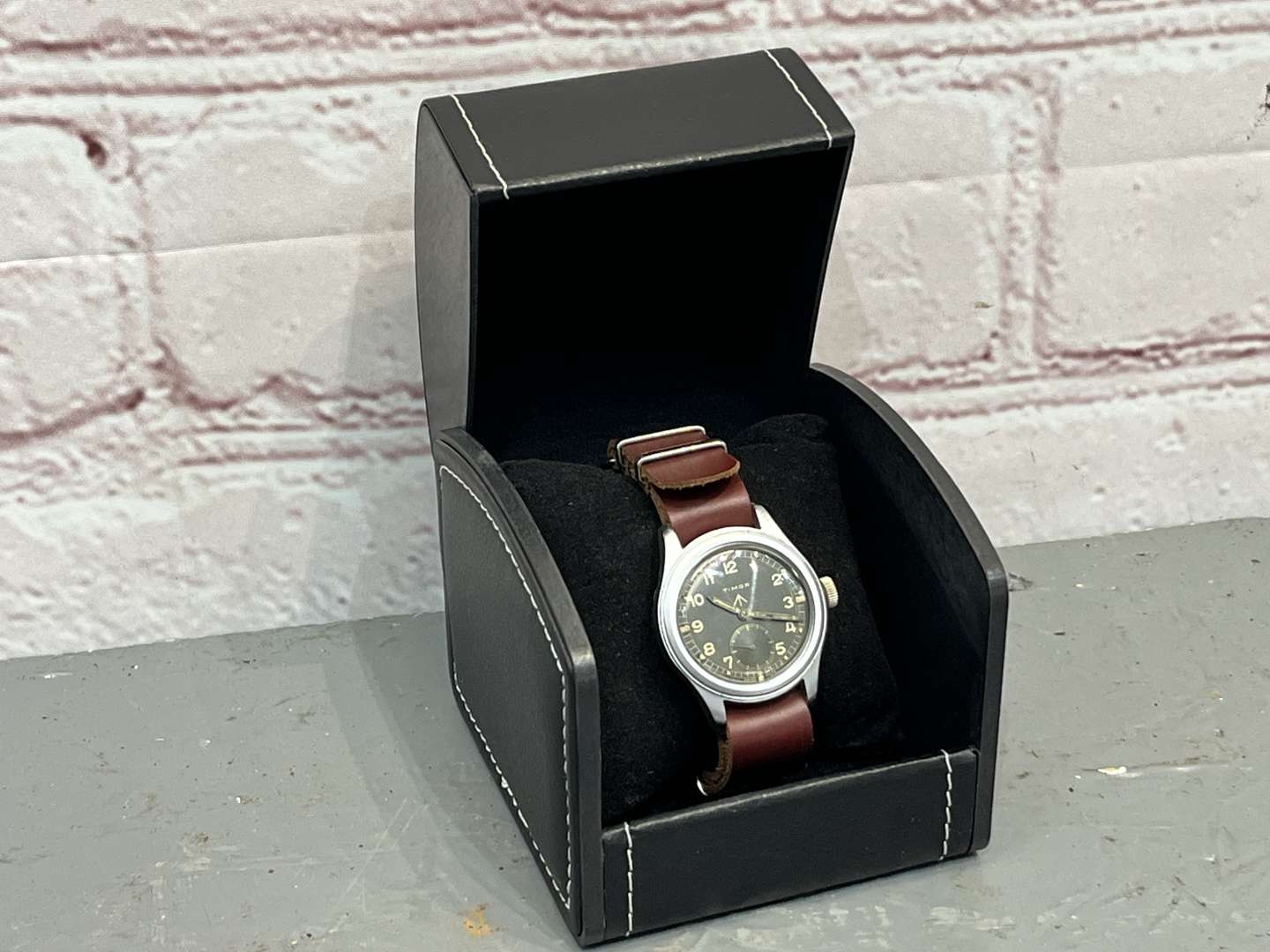 <p>Timor, WWII British Military “Dirty Dozen” Wrist Watch On a Leather Strap</p>