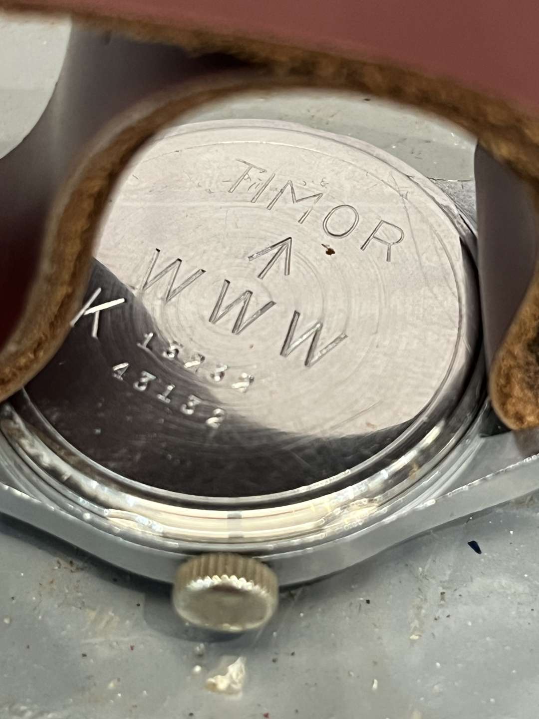 <p>Timor, WWII British Military “Dirty Dozen” Wrist Watch On a Leather Strap</p>