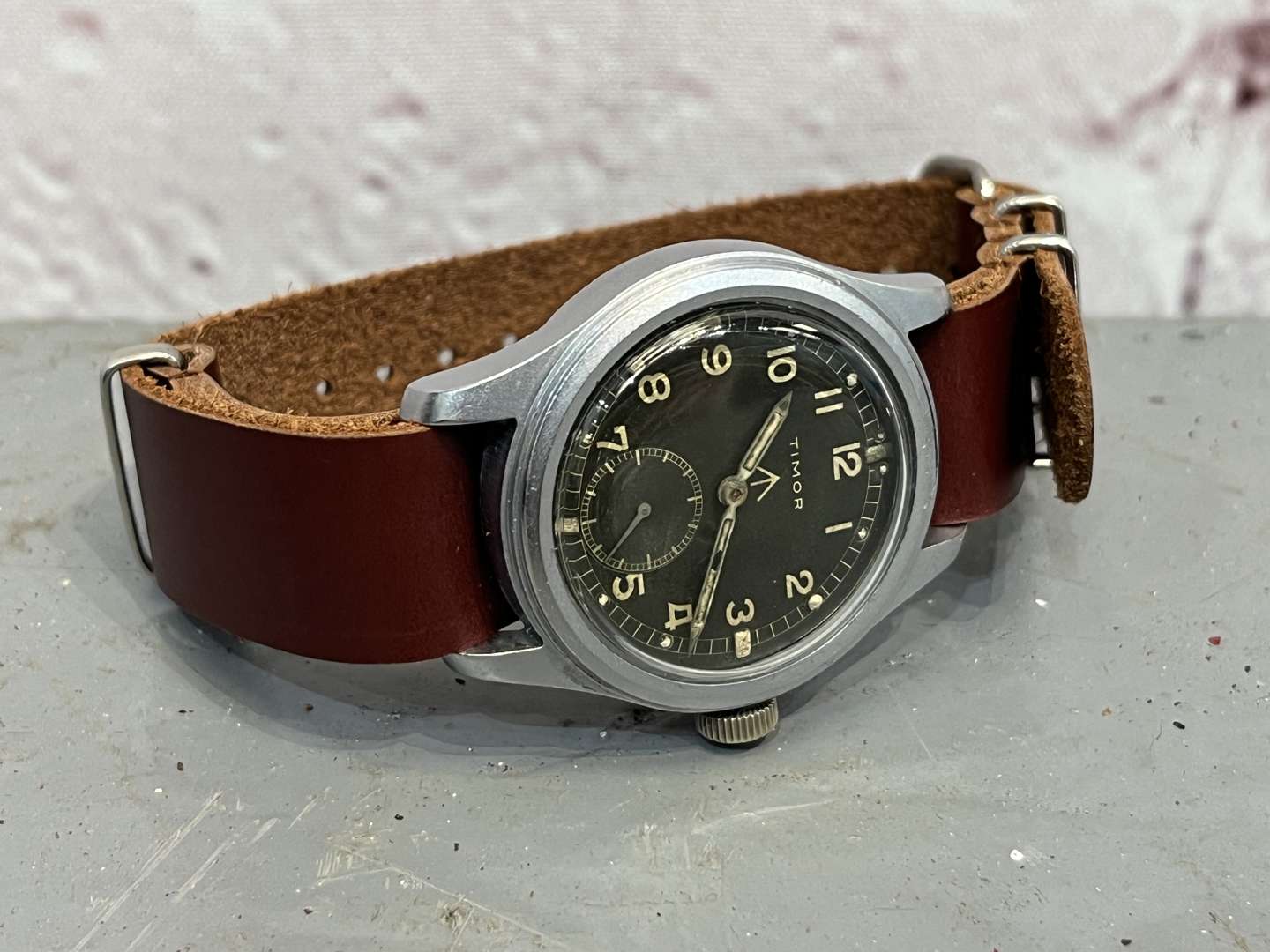 <p>Timor, WWII British Military “Dirty Dozen” Wrist Watch On a Leather Strap</p>