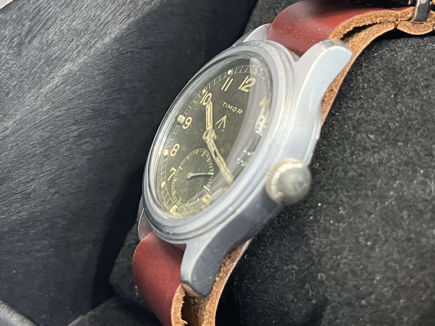 <p>Timor, WWII British Military “Dirty Dozen” Wrist Watch On a Leather Strap</p>