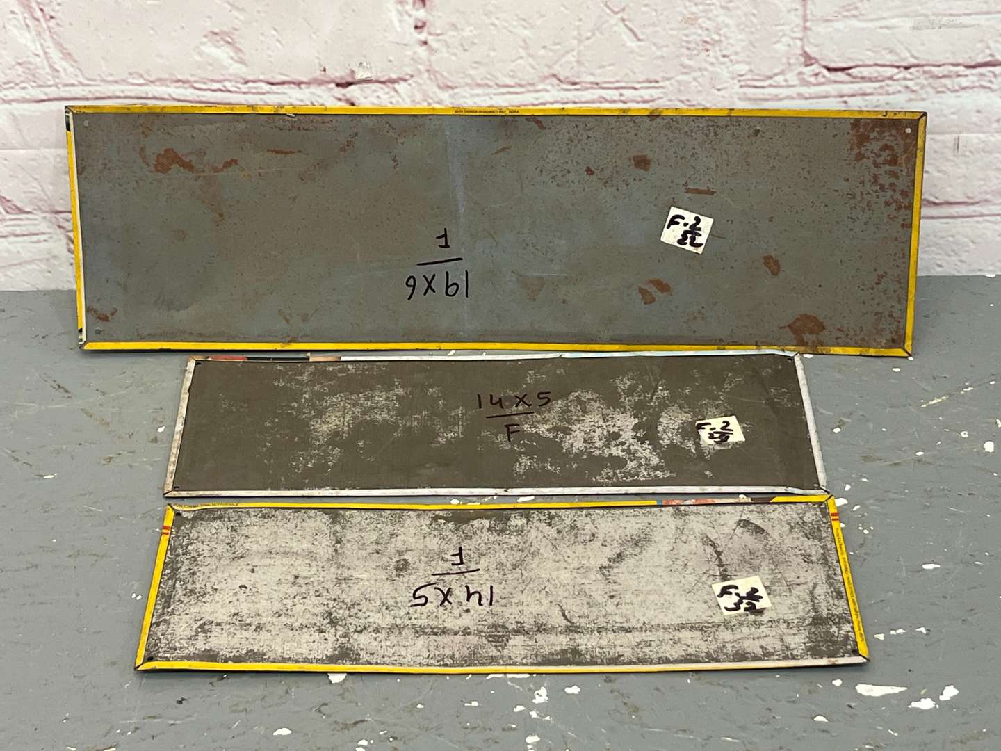 <p>Three Indian Metal Tyre and Industrial Signs</p>