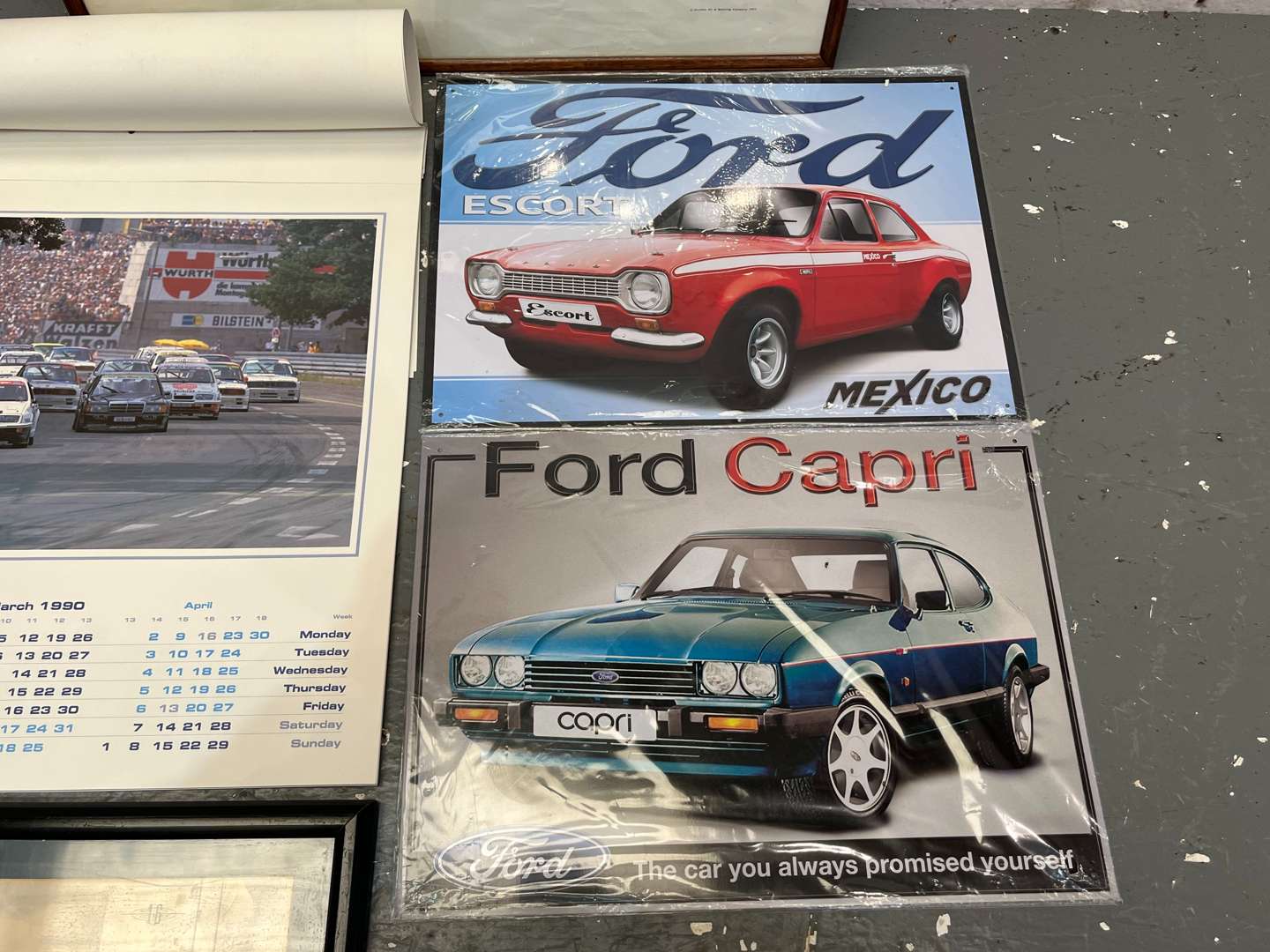 <p>Two Ford Tin Signs, 1990 Ford Calendar Ford Ghia Print & Jim Clark Print (5)</p>