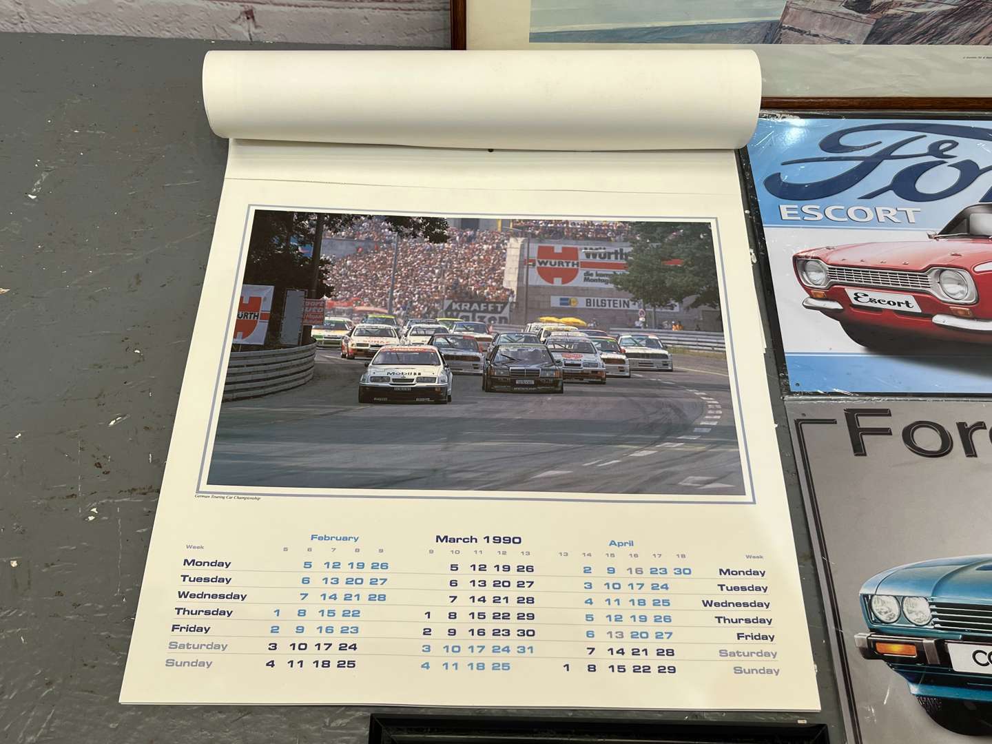 <p>Two Ford Tin Signs, 1990 Ford Calendar Ford Ghia Print & Jim Clark Print (5)</p>