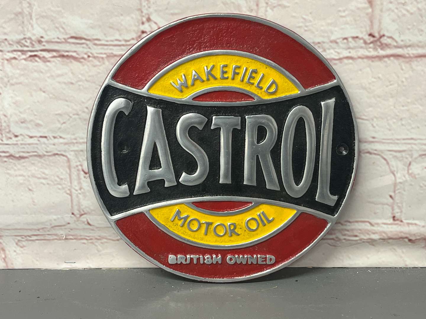 <p>Wakefield Castrol Cast Aluminium Circular Sign</p>
