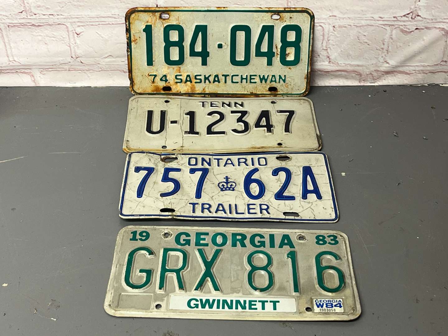 <p>Four American Number Plates&nbsp;</p>